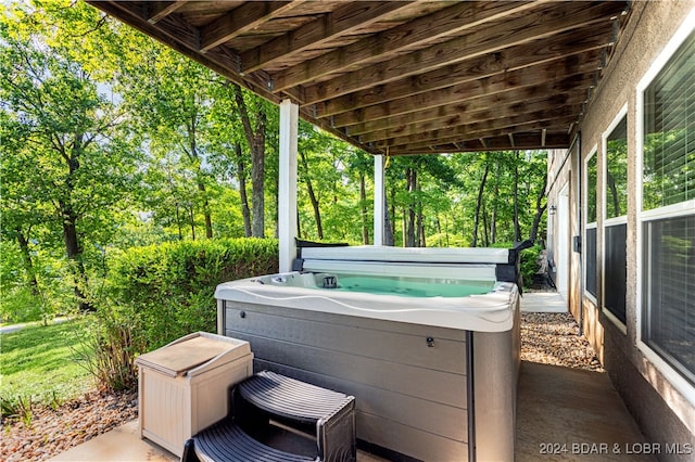 view of patio / terrace with a hot tub