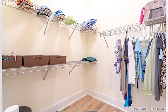 spacious closet featuring hardwood / wood-style floors