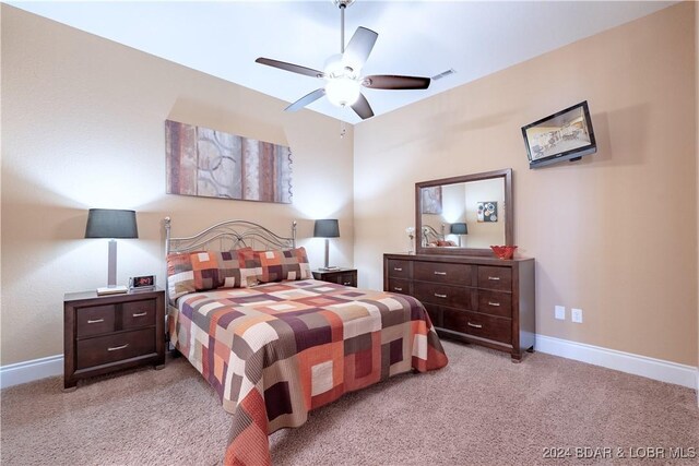 carpeted bedroom featuring ceiling fan