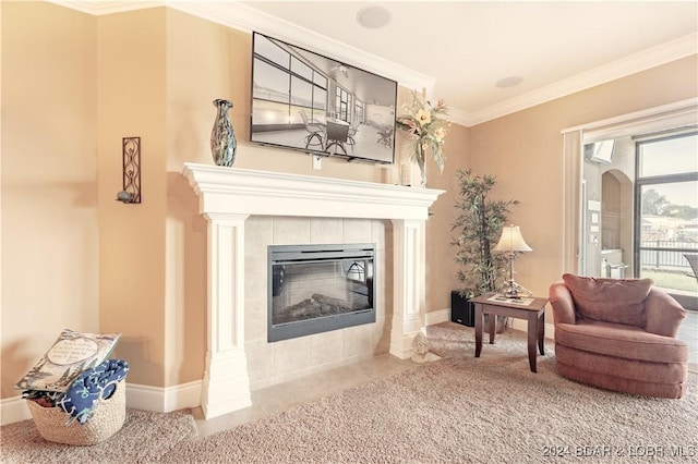 living area featuring carpet, a tiled fireplace, a wall mounted AC, and crown molding