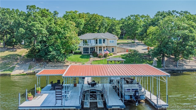 dock area featuring a yard and a water view