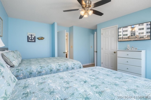 bedroom featuring ceiling fan and carpet floors