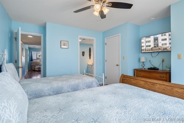 bedroom with ceiling fan and wood-type flooring