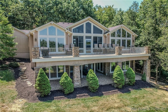 back of house featuring a deck