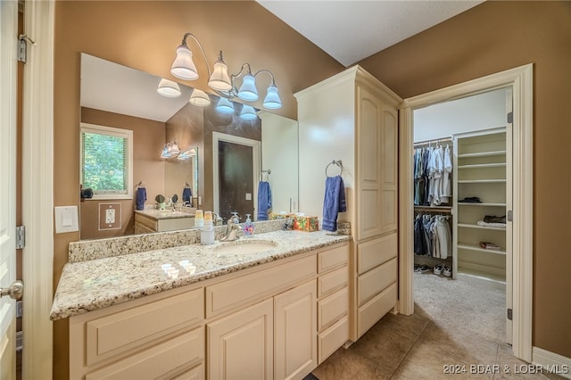 bathroom with vanity and tile patterned flooring