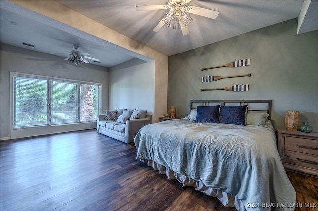 bedroom with dark hardwood / wood-style floors and ceiling fan