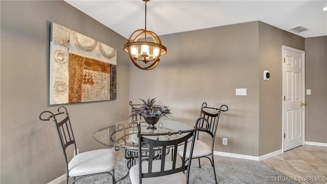 329 Bristol Bay Dr Unit 3B, Lake Ozark, MO 65049 - dining space featuring a chandelier and baseboards