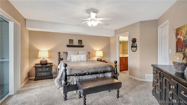 329 Bristol Bay Dr Unit 3B, Lake Ozark, MO 65049 - bedroom with light colored carpet, baseboards, ensuite bathroom, and ceiling fan