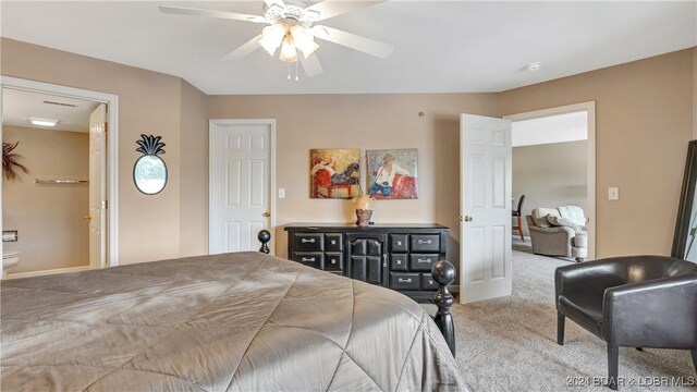 329 Bristol Bay Dr Unit 3B, Lake Ozark, MO 65049 - carpeted bedroom featuring connected bathroom and ceiling fan