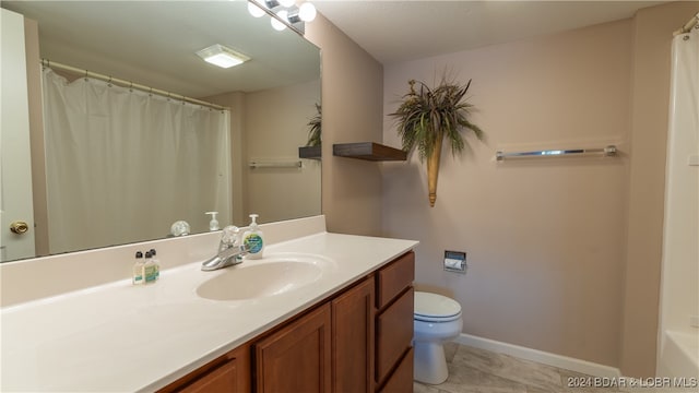 bathroom with vanity, toilet, tile patterned flooring, and a shower with shower curtain