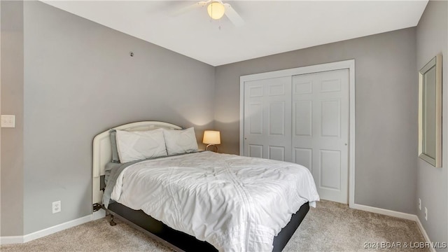 329 Bristol Bay Dr Unit 3B, Lake Ozark, MO 65049 - carpeted bedroom featuring baseboards, a closet, and a ceiling fan