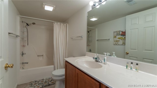 329 Bristol Bay Dr Unit 3B, Lake Ozark, MO 65049 - bathroom featuring toilet, shower / tub combo, tile patterned flooring, and vanity