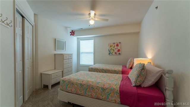 329 Bristol Bay Dr Unit 3B, Lake Ozark, MO 65049 - bedroom featuring carpet, a closet, and ceiling fan