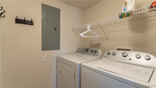 washroom with electric panel and washer and dryer