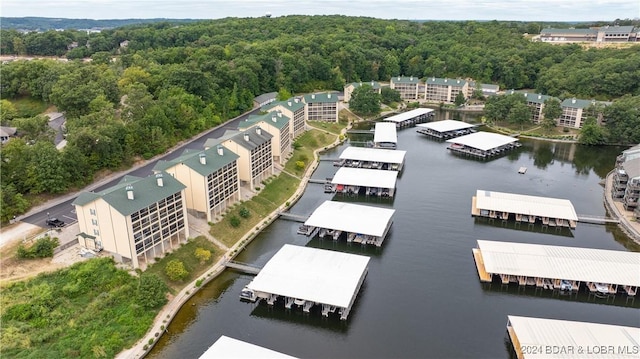 birds eye view of property with a water view