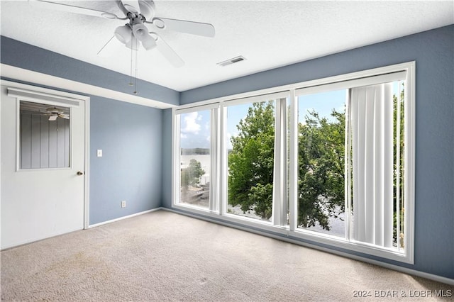 80 Regatta Bay Cir Unit 2B, Lake Ozark, MO 65049 - carpeted empty room featuring ceiling fan and baseboards