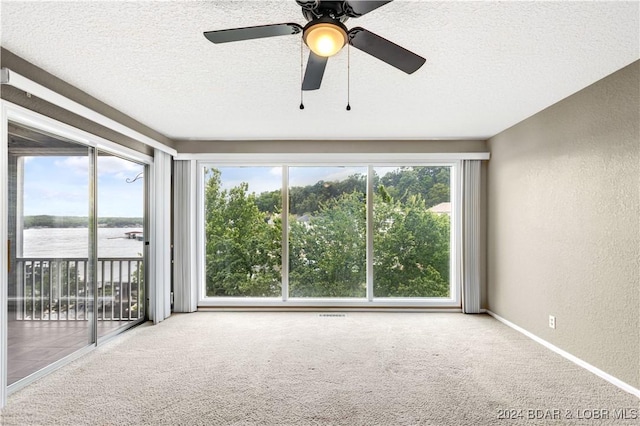 80 Regatta Bay Cir Unit 2B, Lake Ozark, MO 65049 - unfurnished sunroom with a water view