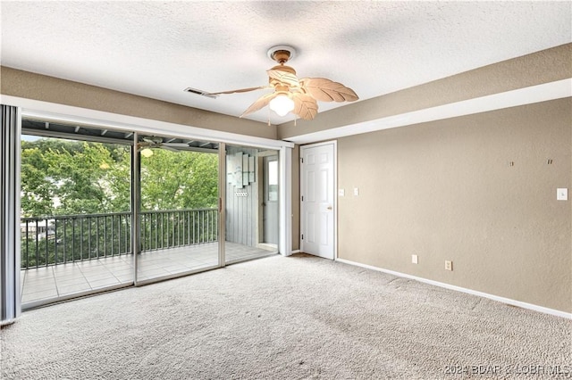 80 Regatta Bay Cir Unit 2B, Lake Ozark, MO 65049 - carpeted empty room with ceiling fan, a textured wall, a textured ceiling, and baseboards