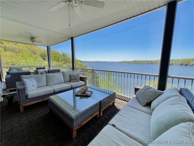 view of patio with ceiling fan, an outdoor hangout area, and a water view