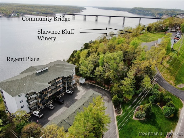 birds eye view of property featuring a water view