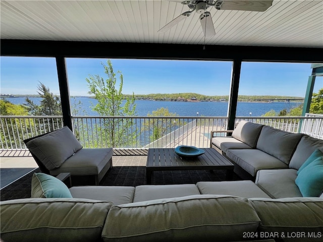 interior space featuring ceiling fan, an outdoor living space, and a water view