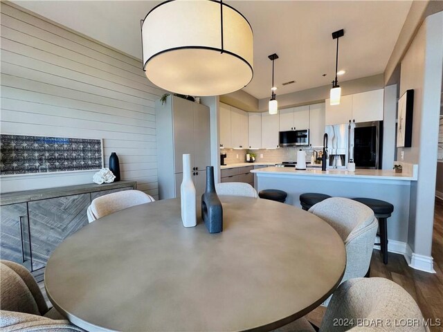 dining room with dark wood-type flooring