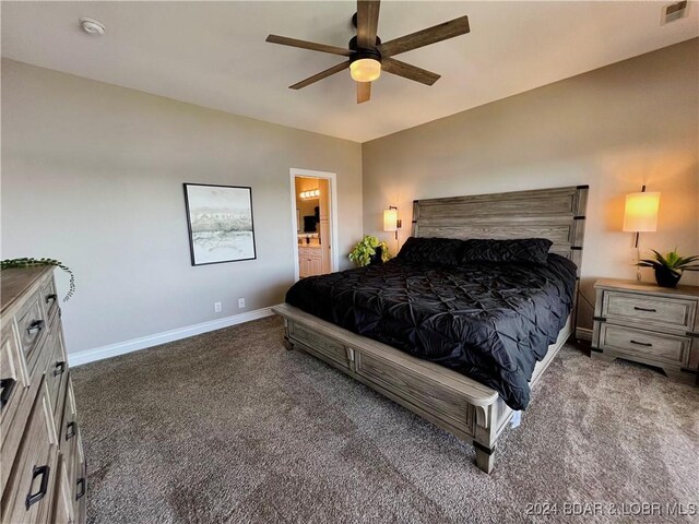 bedroom with ceiling fan, ensuite bathroom, and carpet floors