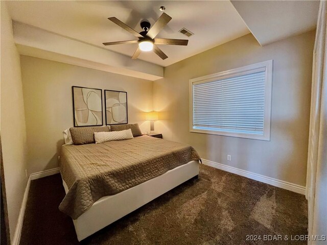 bedroom featuring ceiling fan and carpet