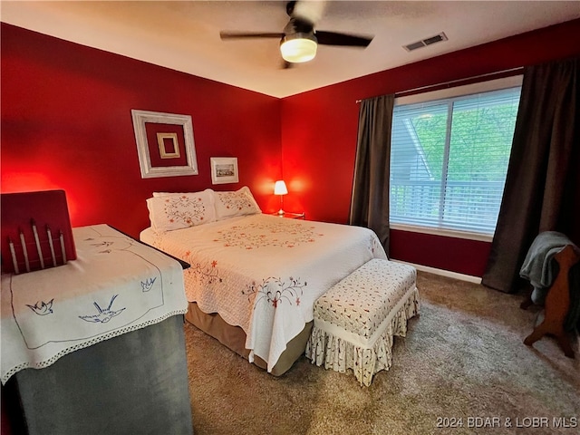 bedroom featuring ceiling fan and carpet