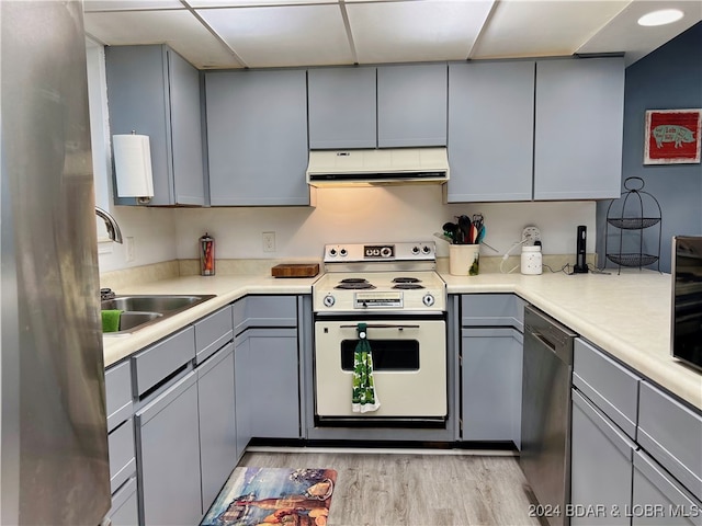 kitchen featuring white electric range, gray cabinets, range hood, and dishwasher