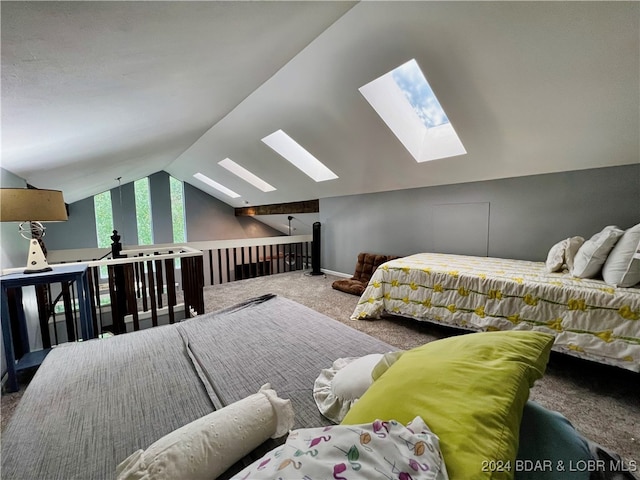 carpeted bedroom with lofted ceiling with skylight