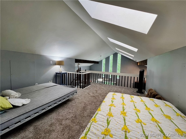 bedroom with carpet floors and vaulted ceiling with skylight