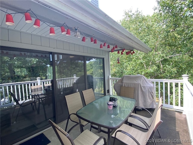 wooden terrace with a grill