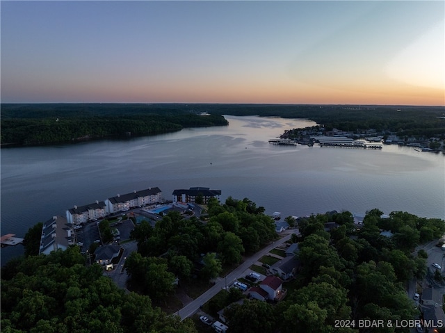 aerial view at dusk with a water view