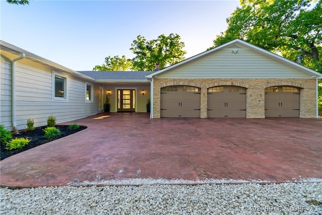 ranch-style home with a garage