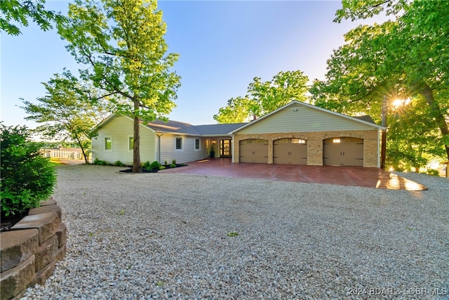 ranch-style house featuring a garage