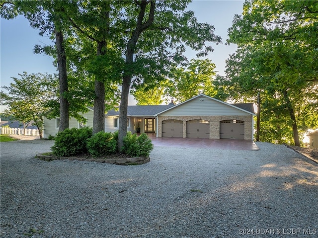 single story home featuring a garage