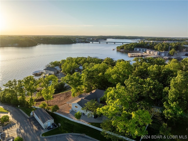 aerial view at dusk with a water view