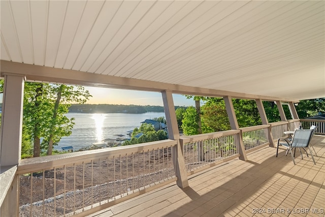 wooden deck featuring a water view