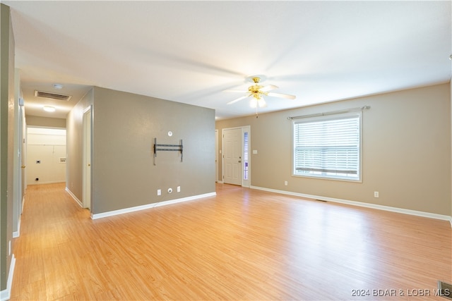 spare room featuring ceiling fan and light wood-type flooring