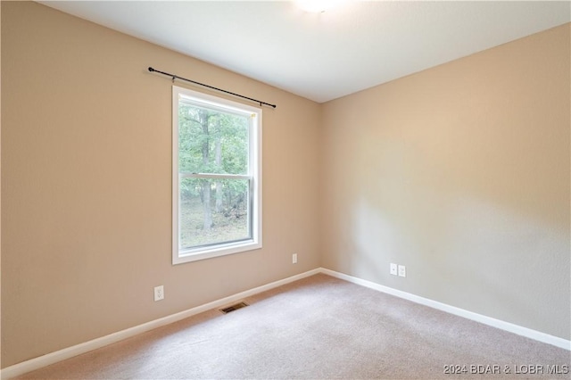 empty room featuring carpet floors