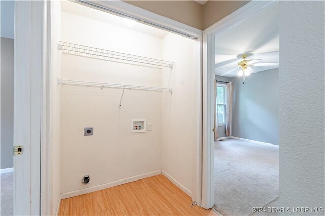 laundry area featuring washer hookup, ceiling fan, electric dryer hookup, and hardwood / wood-style floors