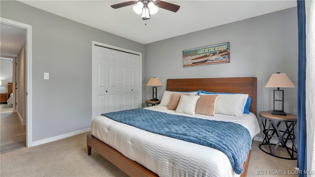 carpeted bedroom featuring a closet and ceiling fan