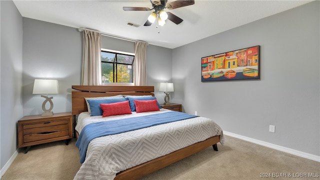 bedroom featuring ceiling fan and light colored carpet