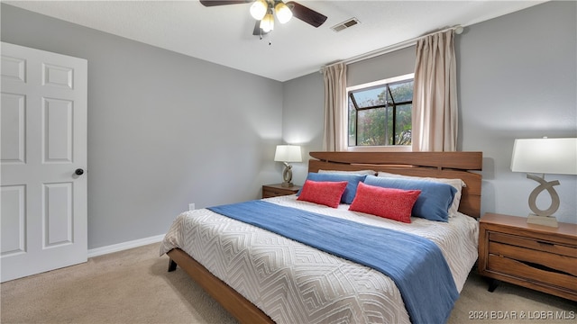 carpeted bedroom featuring ceiling fan