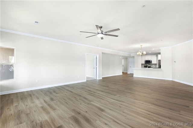 unfurnished living room featuring light hardwood / wood-style floors, ceiling fan with notable chandelier, and crown molding