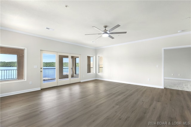 spare room with ceiling fan, crown molding, and dark hardwood / wood-style flooring