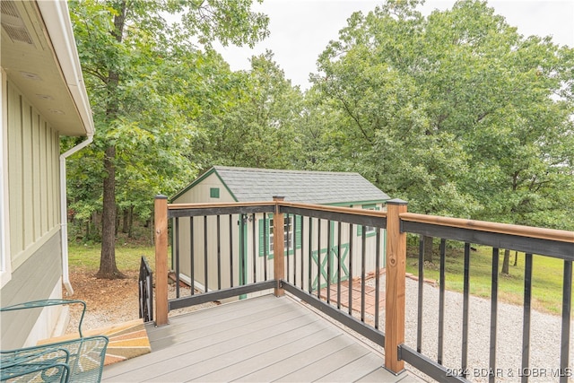 wooden terrace with a shed