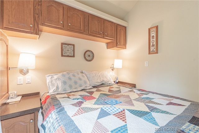 bedroom with lofted ceiling