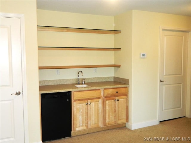 bar featuring light carpet, black dishwasher, baseboards, and a sink